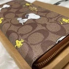 COACH x PEANUTS Snoopy & Woodstock Long Zip-Around Wallet – Khaki Signature Canvas CE705